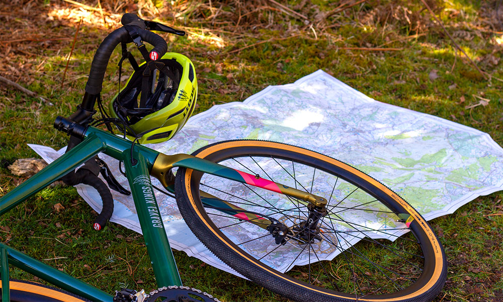 Gravel bike with an OS paper map